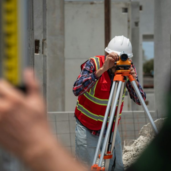 Civil or construction engineer using a survey camera.